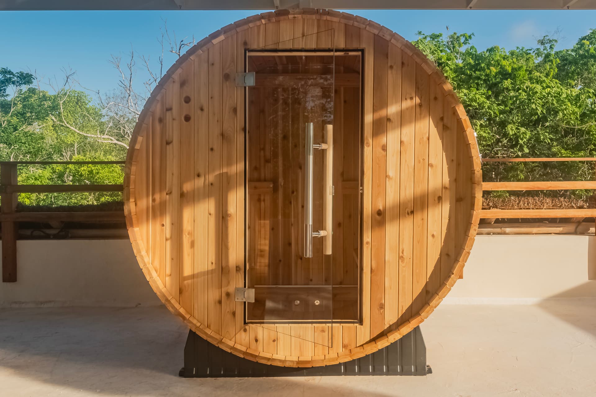 Cedar barrel sauna on the rooftop terrace with jungle views